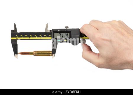 Rifle Bullet shell measuring digital caliper measurements man`s hand holding tool Stock Photo